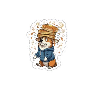 Peut inclure: Autocollant représentant un corgi de dessin animé portant un sweat à capuche bleu, luttant pour équilibrer une pile de crêpes sur sa tête. Les crêpes sont garnies de beurre et de sirop, avec de la vapeur et des gouttes de sirop autour du corgi.