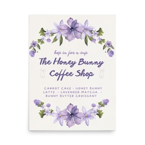 May include: A cream-colored poster with a floral design and text. The text reads "The Honey Bunny Coffee Shop" with a list of menu items. Purple flowers and green leaves form a decorative border around the text.