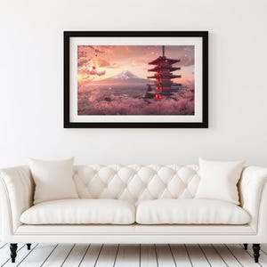 May include: Framed art print depicting a Japanese pagoda and Mount Fuji at sunset. The artwork is set against a backdrop of pink clouds and cherry blossoms. The print is displayed above a white sofa.