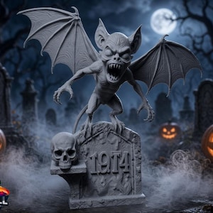 May include: A grey, detailed figurine of a winged creature with sharp teeth and pointed ears, perched atop a tombstone marked with the year 1974. A human skull rests on a small ledge attached to the side of the tombstone, which features carved details.