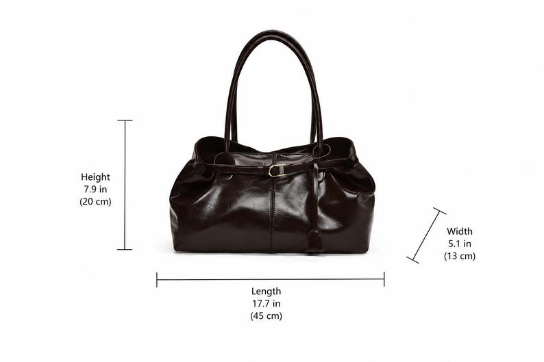 May include: A dark brown handbag with two top handles and a central strap featuring a metallic buckle. The bag measures 7.9 inches in height, 5.1 inches in width, and 17.7 inches in length, as indicated by the visible dimension labels.