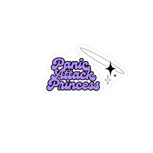 May include: A sticker with the text "Panic Attack Princess" in a purple, bubble-style font. The sticker has a white border and includes a black star and a curved line with two smaller stars.