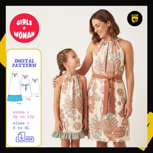 Può includere: Un cartamodello digitale per un abito senza maniche con scollo all'americana, realizzato in tessuto beige con una stampa multicolore di conchiglie e coralli. L'abito presenta una cintura color ruggine e un orlo con volant verde tenue.