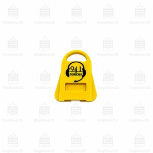 May include: A yellow 911 Dispatcher sign with a handle at the top. The sign features a black graphic of a headset and the text "911 DISPATCHER". The sign has a rectangular cutout at the bottom.