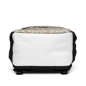 May include: A backpack with a white front panel and a patterned top. The top features a repeating design in muted red, green, and beige. The sides and bottom are black, with black adjustable straps and buckles.