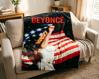 Manta macia com estampa da bandeira americana da Beyoncé e chapéu de cowboy preto e branco.