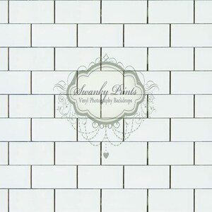 May include: White subway tile backdrop with a decorative logo that says "Swanky Prints Vinyl Photography Backdrops".