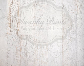 May include: Whitewashed wood backdrop with a faded, distressed look. The wood has a light brown color and a rough texture. The backdrop is perfect for photography and can be used for a variety of purposes.