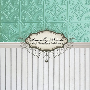 May include: A vinyl photography backdrop featuring a teal, embossed tin tile design above a white vertical shiplap. The backdrop includes the text "Swanky Prints Vinyl Photography Backdrops".