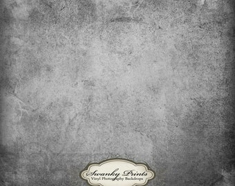 May include: A grey textured background with a white logo that says "Swanky Prints Vinyl Photography Backdrops".