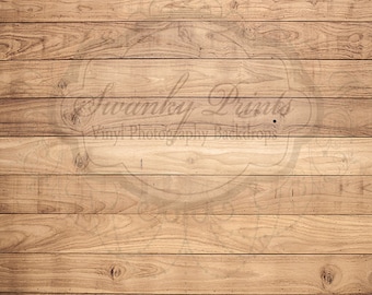 May include: A close-up of a woodgrain background with a faded watermark that says "Swanky Prints Vinyl Photography Backdrops".