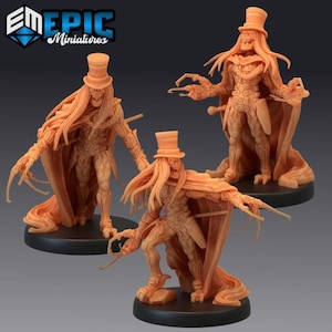 May include: Three orange-colored miniature figures of a skeletal character wearing a top hat and cape. The figures have long hair and claw-like hands. The figures are standing on black circular bases. The logo "EM EPIC Miniatures" is in the top left corner.