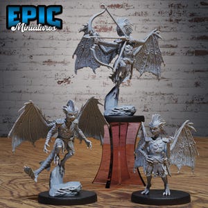 May include: A white ceramic mug with a black handle and the text "But First, Coffee" in a bold, black font. The mug is set against a blurred background, suggesting a cosy setting.