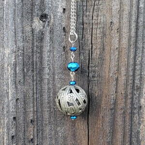 May include: A white ceramic mug with a black handle and the text "But first, coffee" in a handwritten style. The mug is on a white surface. The mug is likely for hot beverages.