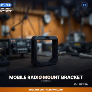 May include: A black mobile radio mount bracket with a rectangular frame. The text "MOBILE RADIO MOUNT BRACKET" is displayed in white. The image also includes the text "STL FILE INSTANT DOWNLOAD".