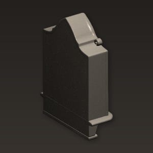 Puede incluir: Un objeto rectangular gris con una parte superior curvada y una pequeña protuberancia redondeada. El objeto tiene una superficie texturizada y un pequeño detalle en forma de estante en la parte inferior. Es probable que sea un artículo decorativo o funcional.