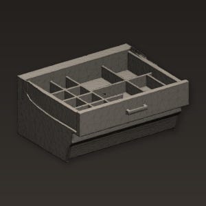 May include: A gray jewelry organizer with multiple compartments and a drawer. The open drawer reveals a grid of small storage spaces, ideal for rings, earrings, and other small items. The organizer is made of a solid material.