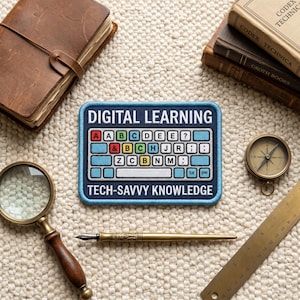 May include: A rectangular embroidered patch featuring the text DIGITAL LEARNING and TECH-SAVVY KNOWLEDGE in white, surrounding a graphic of a light blue computer keyboard with colorful letter keys including A, B, C, D, E, J, R, Z, N, M.