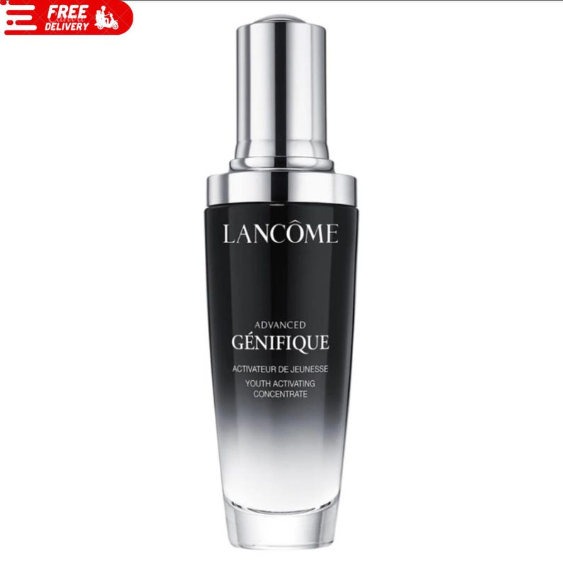 May include: A black and silver Lanc&ocirc;me Advanced G&eacute;nifique Youth Activating Concentrate bottle. The bottle has a gradient design, transitioning from black to clear. The product name and description are printed in white.
