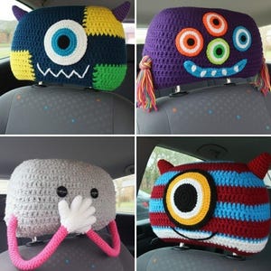 May include: Four crocheted monster headrest covers in various colours. One is blue, yellow, and green with a large eye and jagged teeth. Another is purple with multiple eyes and rainbow tassels. The third is grey with button eyes and white hands. The last is red, blue, and yellow striped.