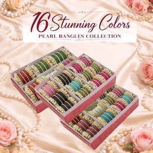 May include: Three red boxes filled with pearl bangles in various colors, including green, pink, black, and teal. The boxes are arranged on a satin surface, with text that reads "16 Stunning Colors PEARL BANGLES COLLECTION."