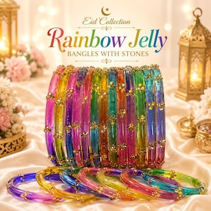 May include: A collection of colorful, transparent bangles with gold-colored stone accents. The text "Eid Collection" and "Rainbow Jelly BANGLES WITH STONES" is displayed. The bangles are arranged on a white satin surface.