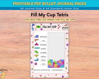 Könnte beinhalten: Eine druckbare PDF-Bullet-Journal-Seite mit dem Titel Fill My Cup Tetris. Die Seite enthält ein Raster zur Verfolgung von Gewohnheiten wie Hund ausführen, Kochen und Wäsche waschen, mit bunten Blöcken unten und einem Feld für eine Belohnung.