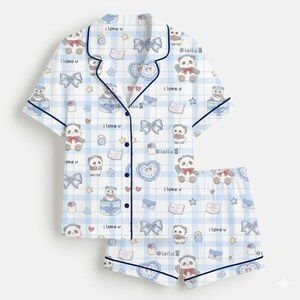 May include: Light blue pajama set with a white plaid pattern, featuring panda bears, bows, hearts, and books. The short-sleeved top and shorts have dark blue trim and the text "i love u".