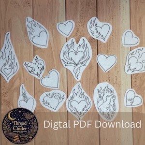 Puede incluir: Una colección de parches de tela blanca con contornos bordados en negro de varias formas de corazón, algunos simples y otros rodeados de llamas. Un logotipo circular muestra el texto Thread and Cinder Digital PDF Download.