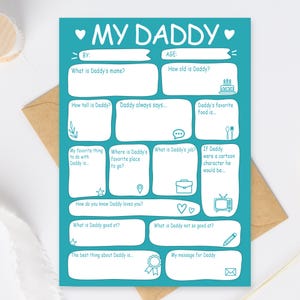 Puede incluir: Una tarjeta turquesa para rellenar titulada "MY DADDY" con espacios para detalles personales. La tarjeta incluye preguntas como "¿Cuál es el nombre de papá?" y "La comida favorita de papá es..." con corazones e iconos decorativos.