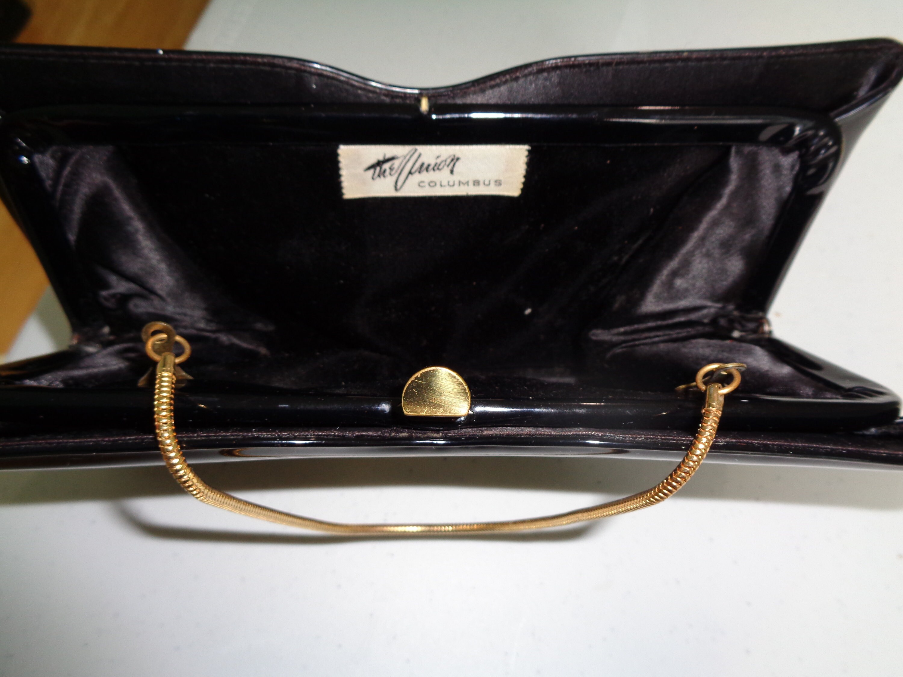 black patent leather clutch