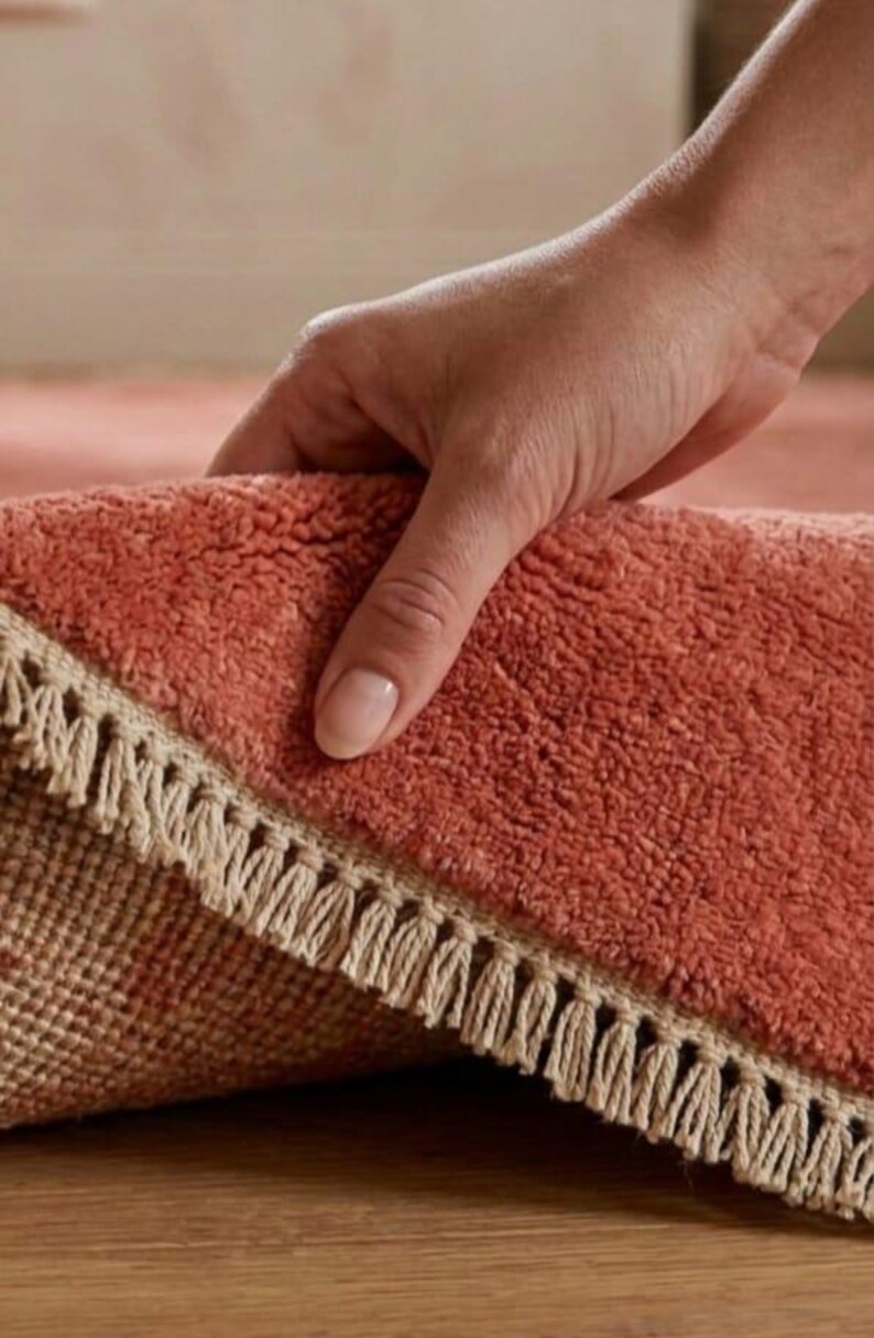 Luxury hand knotted terracotta rug wooden floor