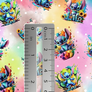 May include: Colorful fabric featuring a repeating pattern of the character Stitch from Lilo & Stitch. The blue character is surrounded by sunflowers, butterflies, and splashes of color. The ruler shows approximately 2 inches.