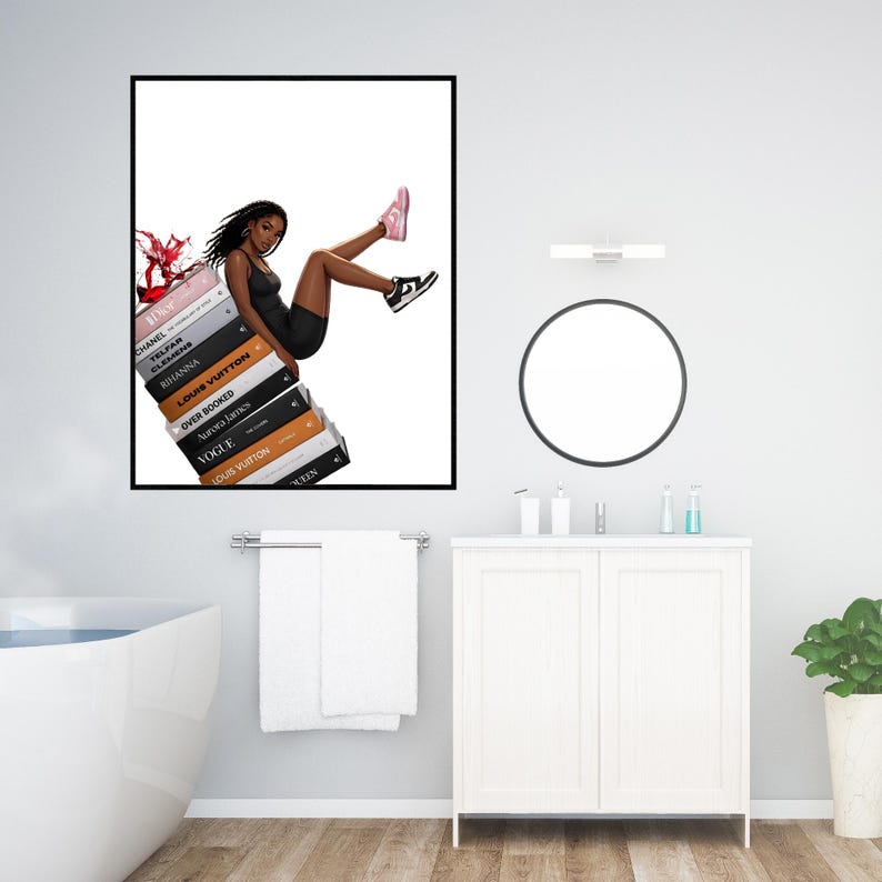 May include: A framed art print featuring a fashion illustration of a person in a black dress and sneakers, sitting atop a stack of books. The books have titles like "Vogue" and "Louis Vuitton". A splash of red is visible on the left.