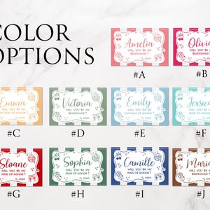 May include: A collection of colorful rectangular cards with names like Amelia, Olivia, and Emma, each with a unique background color and a white striped border. The cards feature the text "Will you be my bridesmaid?" and decorative musical notes.