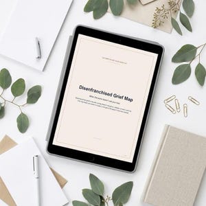 May include: A tablet displaying a document titled Disenfranchised Grief Map with the subtitle When the world doesn't see your loss. The screen features a light beige background with black text, framed by a dark gray border and a thin line design.
