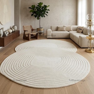 Tappeto beige tinta unita trapuntato a mano, tappeto topografico intagliato a forma di otto, tappeto minimalista scultoreo in lana a doppio anello per l'arredamento del soggiorno.