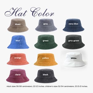 May include: A collection of eleven bucket hats in khaki, grey, navy blue, blue, green, grey green, orange, yellow, white, claret, and black. Text reads Hat Color and Adult sizes 56-58 centimeters, 22-23 inches, children's sizes 52-54 centimeters, 20.5-21 inches.