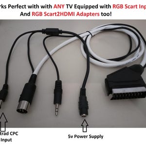 Peut inclure: Un câble multi-connecteurs avec une prise SCART noire, une entrée d'alimentation 5v, une prise audio 3,5 mm, un connecteur DIN circulaire et une prise d'alimentation CC. Le texte indique : Works Perfect with with ANY TV Equipped with RGB Scart Input And RGB Scart2HDMI Adapters too!