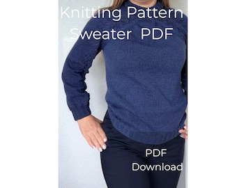 May include: A navy blue knitted sweater with a textured pattern. The image includes the text "Knitting Pattern Sweater PDF Download". The sweater has long sleeves and a crew neck. The model is wearing black pants.