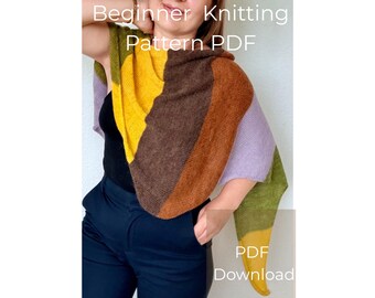 May include: A color-blocked knitted shawl featuring sections of mustard yellow, dark brown, rust orange, lavender, and olive green. The text "Beginner Knitting Pattern PDF" and "PDF Download" is overlaid on the image of the triangular garment.