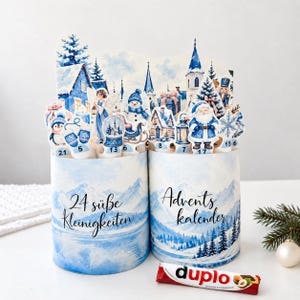 Duplo adventskalender med 24 designer och tomma mallar | Blå vinterby | Utskrivbara chokladpapper | DIY julnedräkning