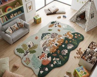 May include: An irregularly shaped area rug featuring a forest theme with a light green and dark green background. The rug displays tufted illustrations of a fox, deer, squirrel, hedgehog, owl, mushrooms, oak leaves, and ferns in earthy tones.