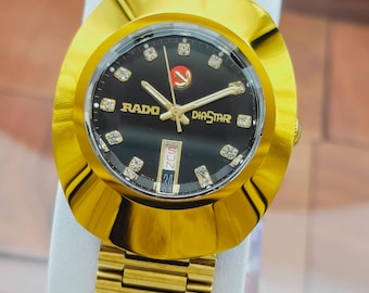 Reloj de pulsera automático vintage Rado Diastar para hombre, chapado en oro, esfera negra.