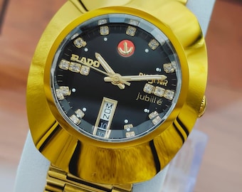 Reloj de pulsera automático vintage Rado Diastar para hombre, chapado en oro, esfera negra.