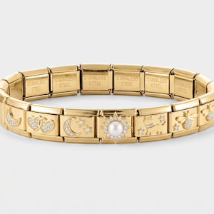 May include: Gold-toned stainless steel charm bracelet. The bracelet features various charms with celestial and nature-inspired designs, including moons, hearts, stars, and bees. Some charms are embellished with small, clear crystals. The bracelet is made of stainless steel.