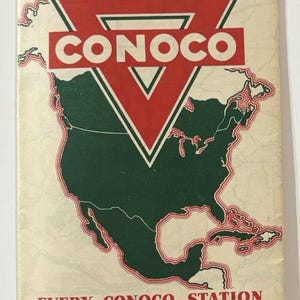 May include: Vintage travel brochure for St. Louis and vicinity, featuring the Conoco logo. The brochure has a map of North America in green, with the Conoco logo in red. Text includes "Travel St. Louis" and "Conoco Travel Bureau."
