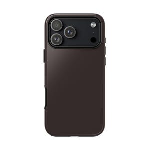 May include: A dark brown smartphone case with a smooth matte finish. The back features a rectangular camera cutout containing three circular lenses arranged in a triangular pattern, alongside a circular flash and a small sensor opening.