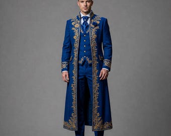 May include: A royal blue long coat, vest, and trousers set featuring intricate gold embroidery along the front edges and cuffs. The ensemble includes a white collared shirt, a blue necktie, and a small blue lapel flower, paired with black shoes.