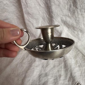 May include: A rustic wooden sign with the text "Welcome to our home" in white lettering. The sign has a distressed finish and a simple, inviting design, ideal for entryway decor.